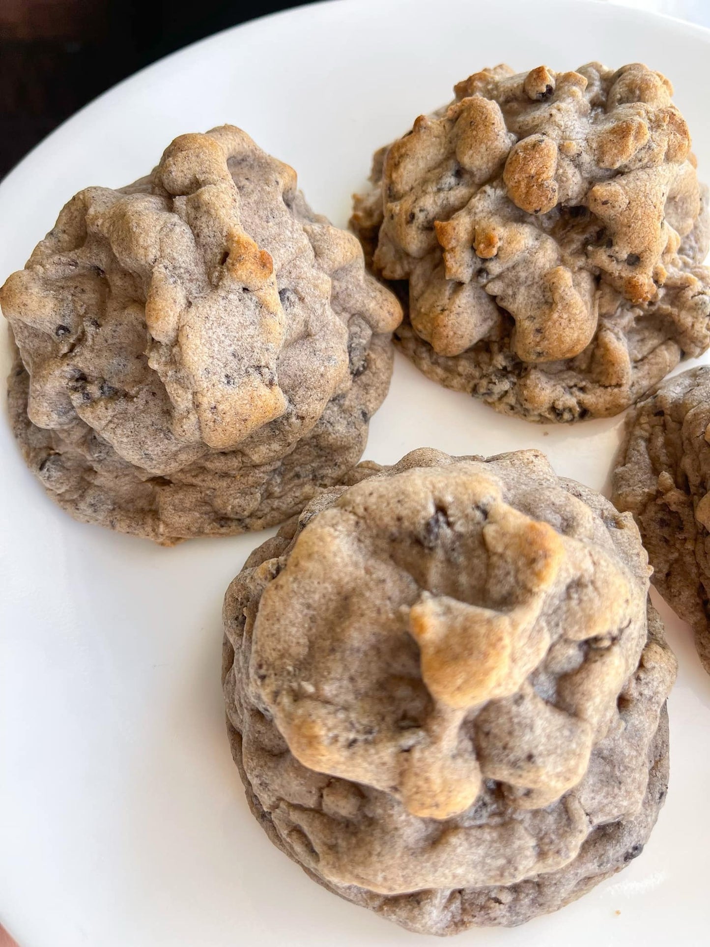 Gourmet cookie from Bella Dolce Bakery, showcasing a freshly baked, golden-brown C'Squared Gourmet Cookie with chocolate chips.