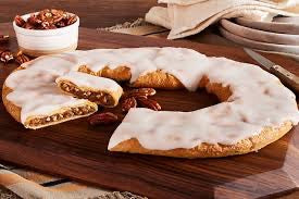 Fresh Kris Kringle-Snatch Kringle pastry from Bella Dolce Bakery, golden-brown with flaky layers and sweet filling, ready to enjoy.